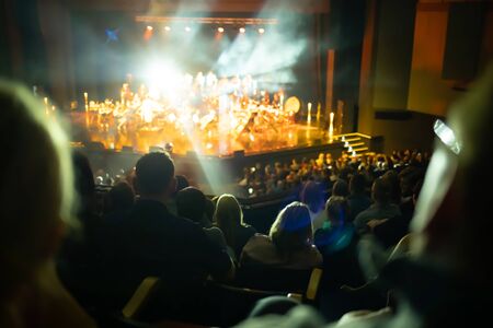 Lights on stage during concert in hall filled with spectatorsの写真素材