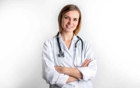 Medical concept of young female doctor in white coat with stethoscopeの写真素材