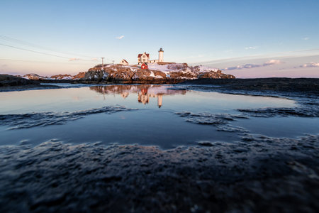 Lighthouse on the island of Stavanger in Norway at sunsetの写真素材