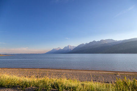 Scenic view of a lake with mountain landscapeの写真素材