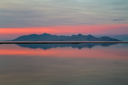 Sunset on the lake with mountains in the background, Salt Lake, Utahの写真素材