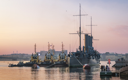 SAINT PETERSBURG, RUSSIA - SEPTEMBER 21 2014: Towbars prepare to transport cruiser \\\Aurora\\\ to...