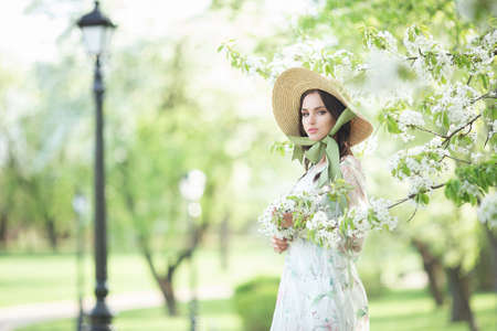 Elegant fashion girl in the garden