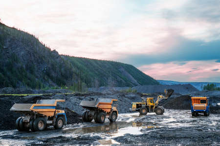 Loading of mountain soil into the body of a mining dump truck using a wheel loader, and further...