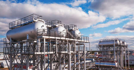 Clody day. Oil and gas industry, oil refining and processing, oil pumping station for further transportation of oil through pipes and maintaining the appropriate pressure in the pipes.の写真素材