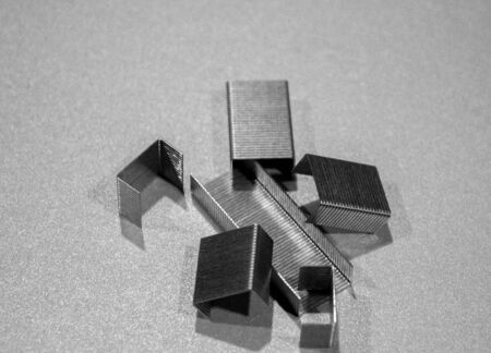 Pile of staples on desk in monochromeの写真素材