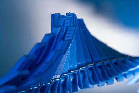 Plastic clothespins on the line in wave formの写真素材