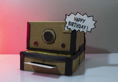 Sign "Happy Birthday" on made instant camera made of cardboardの写真素材