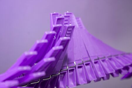 Plastic clothespins on the line in wave formの写真素材