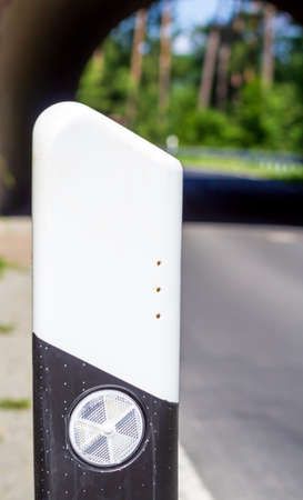 reflector post at the roadside, with three ventilation holesの写真素材