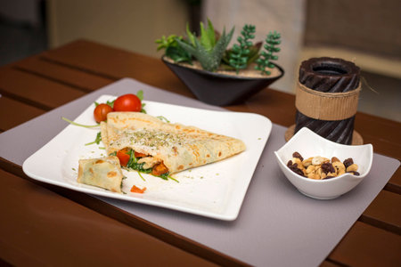 Vegetarian pancake with tomato vegetables and cheese food healthyの写真素材