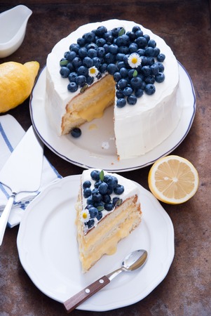 Lemon Blueberry cake on a wooden backgroundの写真素材