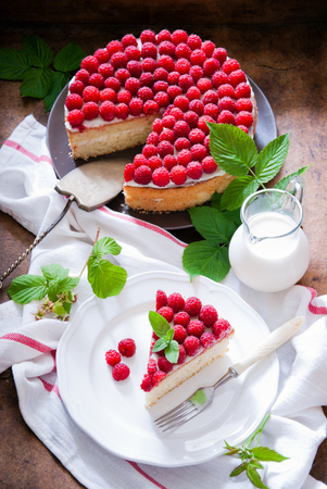 Sponge cake with cream cheese and raspberryの写真素材