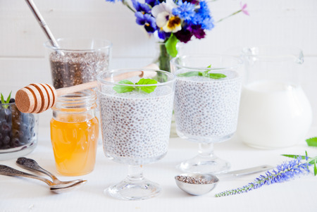 Chia seeds yogurt pudding with honey in glasses for breakfastの写真素材