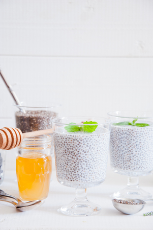 Chia seeds yogurt pudding with honey in glasses for breakfastの写真素材