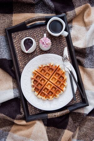 Belgian Waffles and coffee for breakfast in bedの写真素材