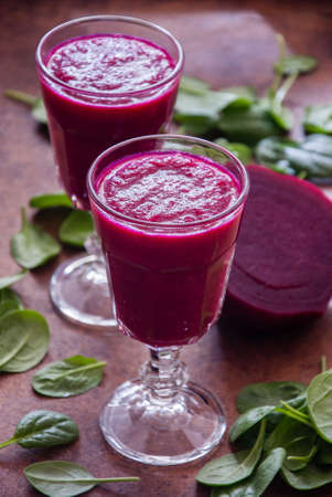 Smoothies of beet and spinach with lime.の写真素材