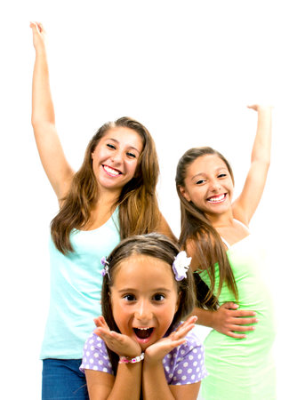 Group of smiling girls posing in front of the roomの写真素材