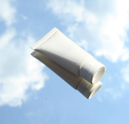 A white product cup is in the air backgroundの写真素材