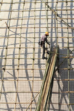building a scaffold with bamboo in Hong Kongの写真素材