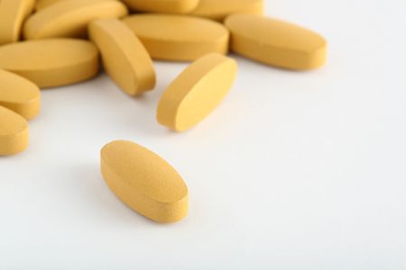 pills spilled on a white backgroundの写真素材