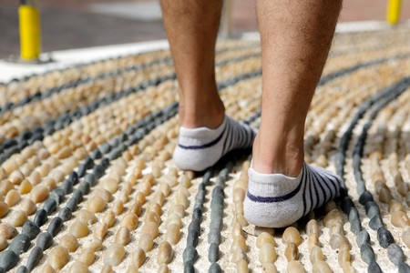 walking on foot message pebble stone pathの写真素材