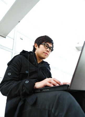 Man using computer outdoorsの写真素材
