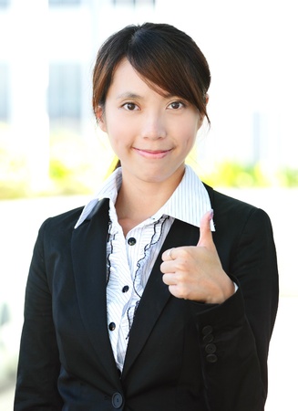 business woman smile and thumbs upの写真素材