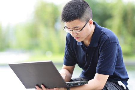 man using computer outdoor
