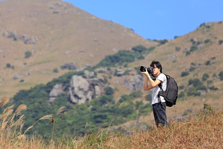 photographer taking photo in country side