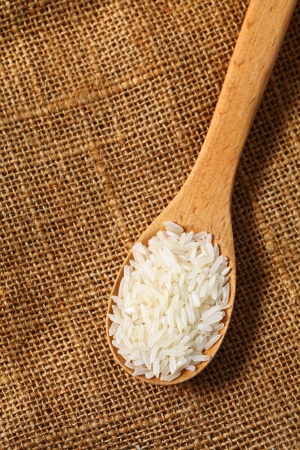 Rice with wooden spoon の写真素材