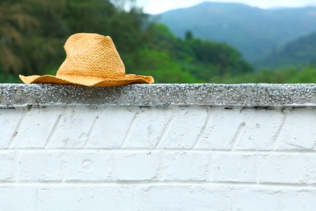 Wicker hat on the wall の写真素材