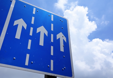 Crossroad signage with arrow の写真素材
