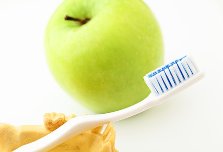 Dental health care  concept, green apple and toothbrushの写真素材