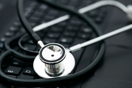 Stethoscope on computer keyboardの写真素材
