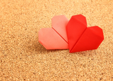 Origami colorful heart on corkboardの写真素材