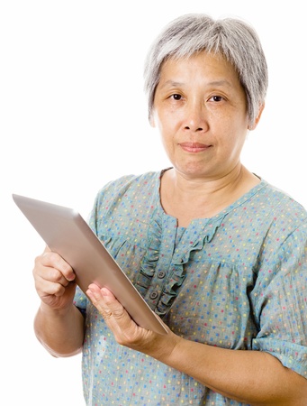 Asian old woman using tabletの写真素材