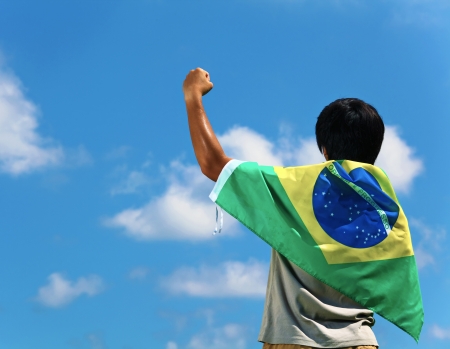 Brazil supporter hand upの写真素材