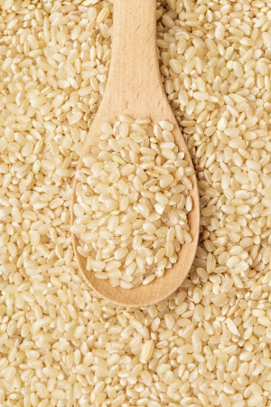 Brown rice on spoonの写真素材