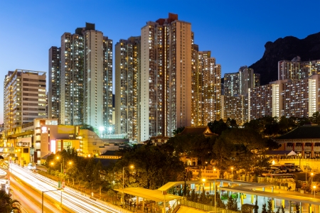 Kowloon with lion rock at nightの写真素材
