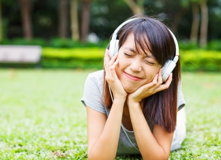 Asian young girl enjoy listen to musicの写真素材