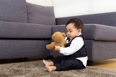Baby boy play dollの写真素材