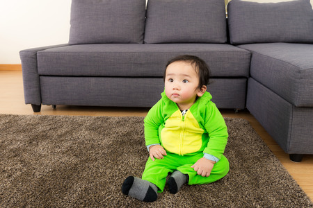Asian Baby with dinosaur halloween party costumeの写真素材