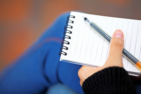 Notepad hold by hand
