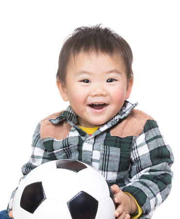 Asian baby boy with soccer ballの写真素材