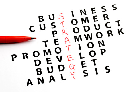 Hand writing strategy concept by crossword の写真素材