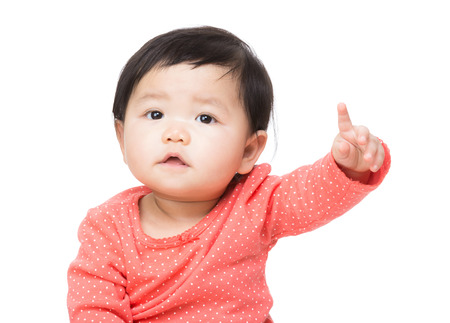 Asian baby girl finger pointing frontの写真素材