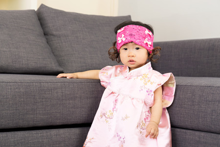 Chinese baby girl in living room
