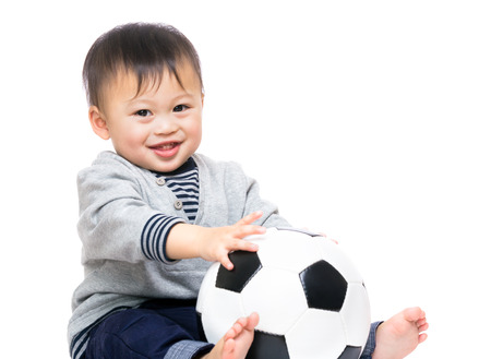Asian baby boy with soccer ballの写真素材