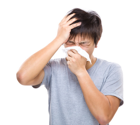 Sneezing and headache of asian manの写真素材